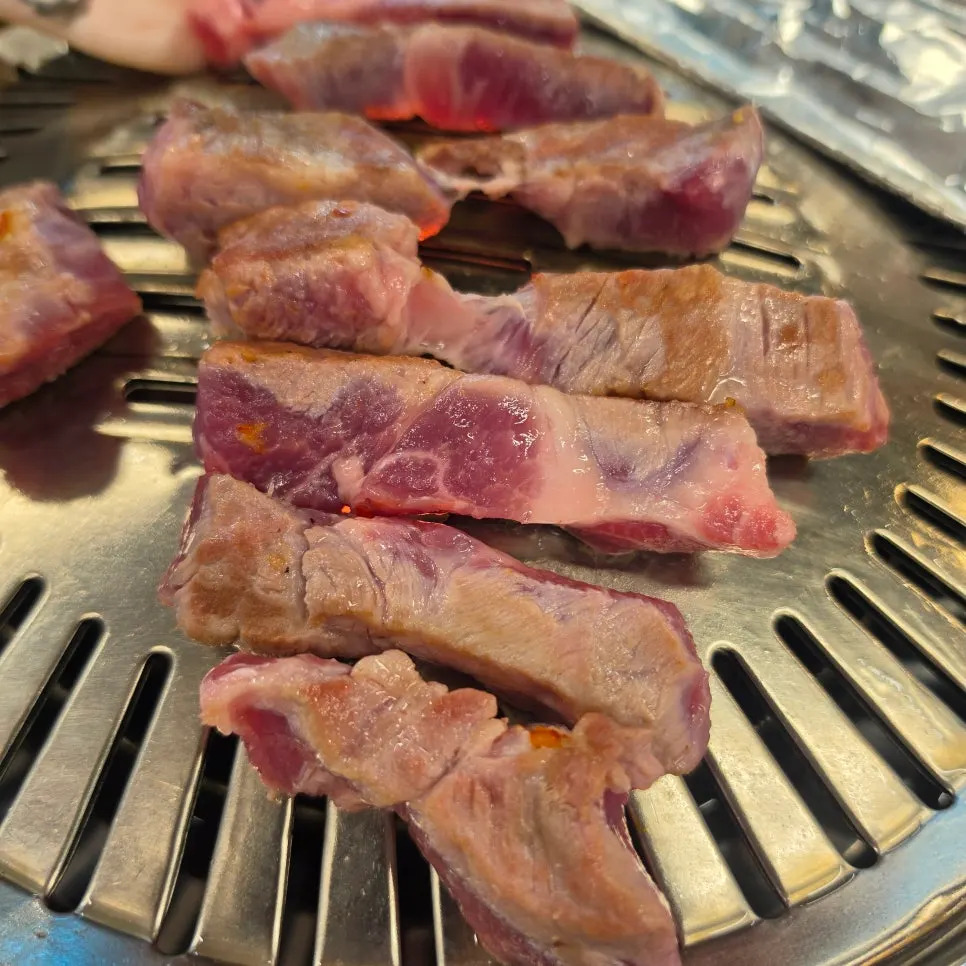 Meat cooking slowly on a grill that wasn't fully heated