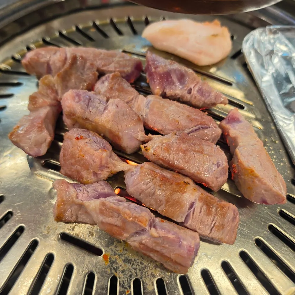 Special pork neck cooking slowly on the charcoal grill