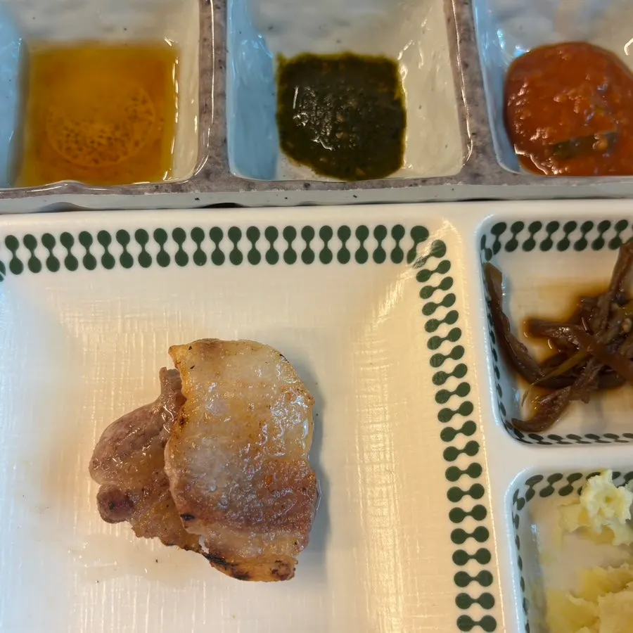 Golden-brown charcoal-grilled pork belly
