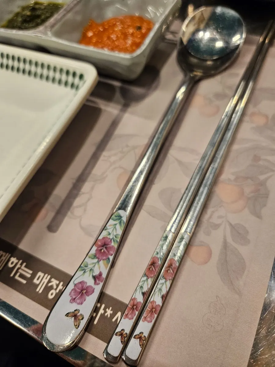 Floral-pattern chairs with matching floral chopsticks and spoons