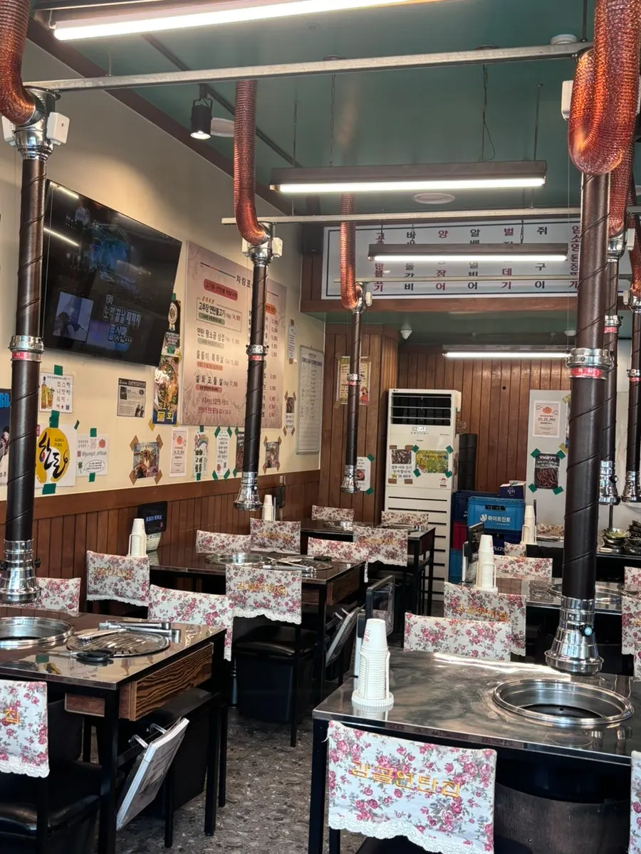 Table with charcoal grill inside Gamgol Yeontanjip