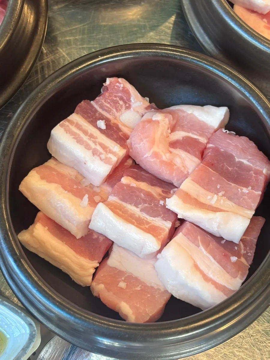 Pork neck and pork belly served in jars