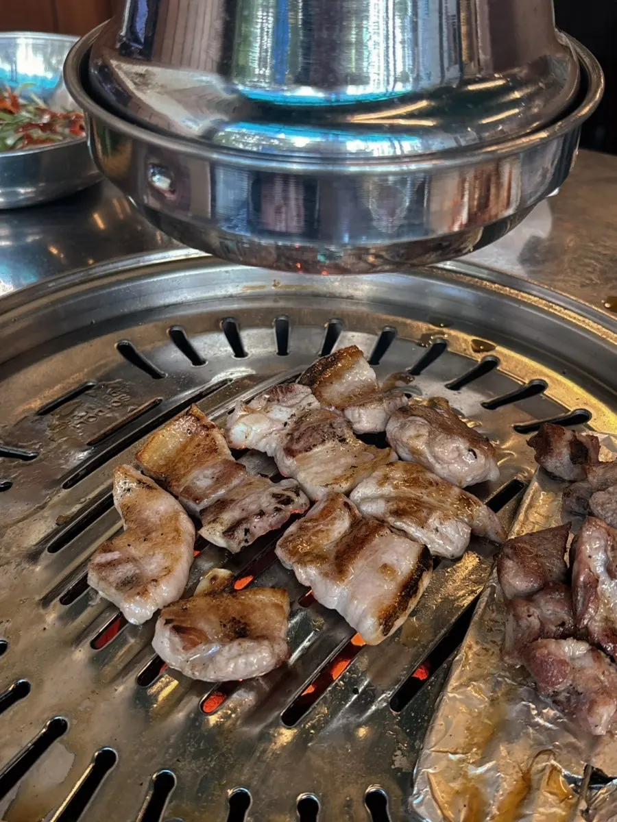 Golden, well-grilled charcoal pork belly