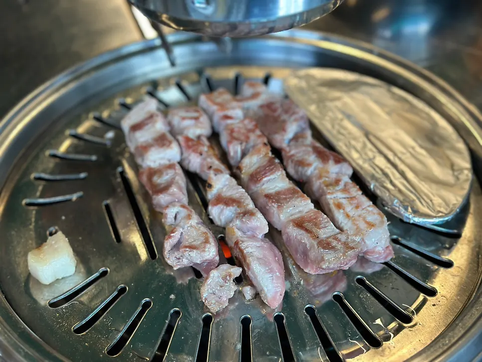 Full spread of food while grilling the teukmoksal