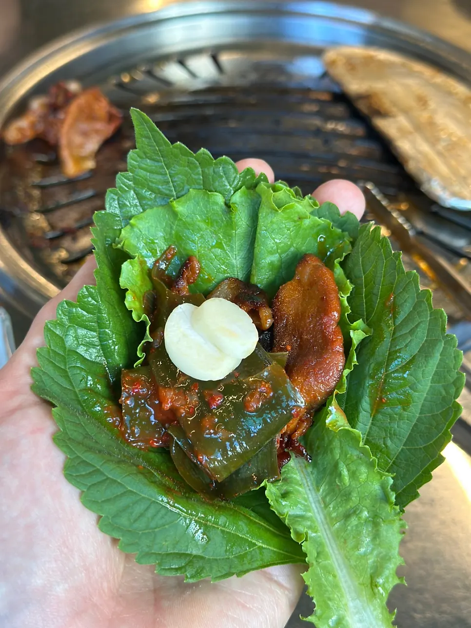 Meat wrapped in lettuce and perilla leaf