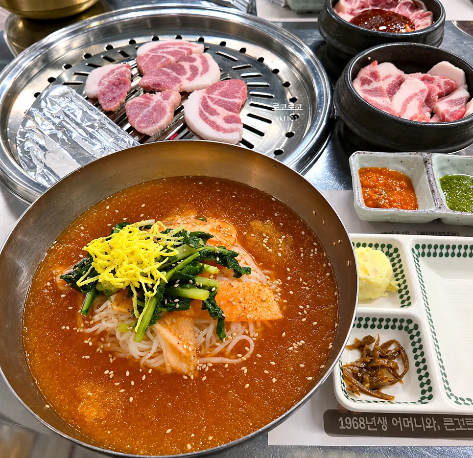 Korean pork gochujang charcoal bulgogi with side dishes spread