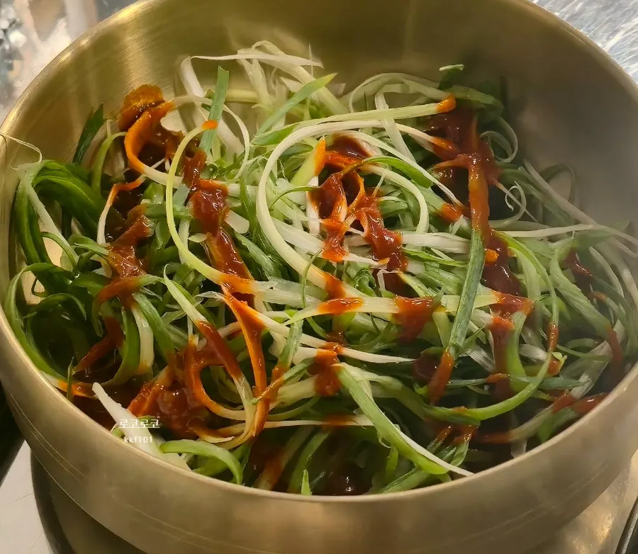Korean pork gochujang charcoal bulgogi served with scallion salad