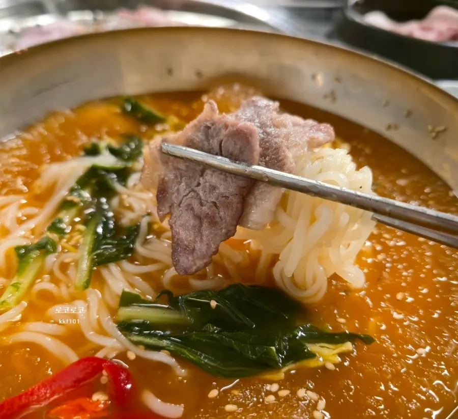 Cool kimchi noodle soup enjoyed alongside the meat