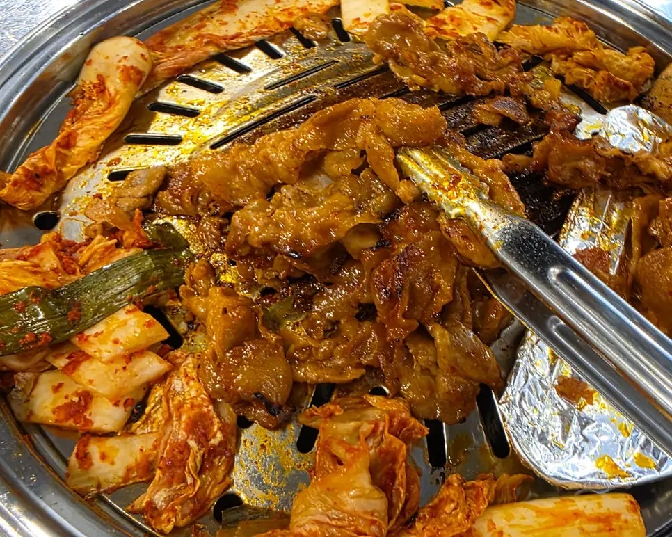 Charcoal bulgogi served with rice and grilled kimchi