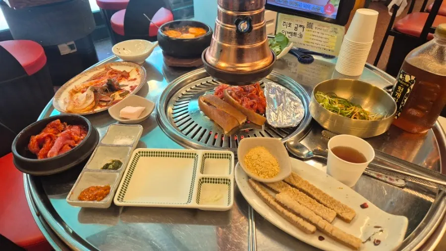 Lettuce wraps, kimchi, and other side dishes