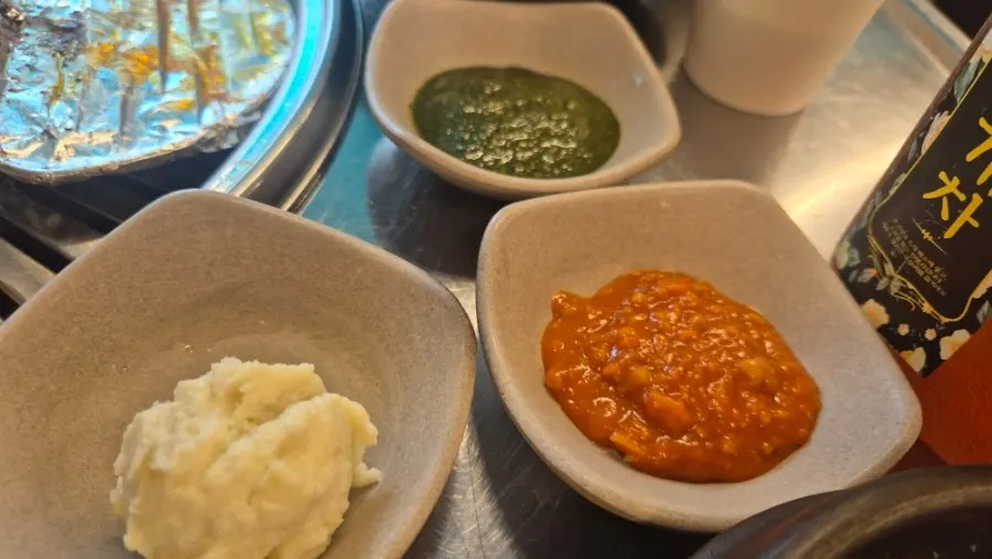 Extra sauces and sides brought to the table