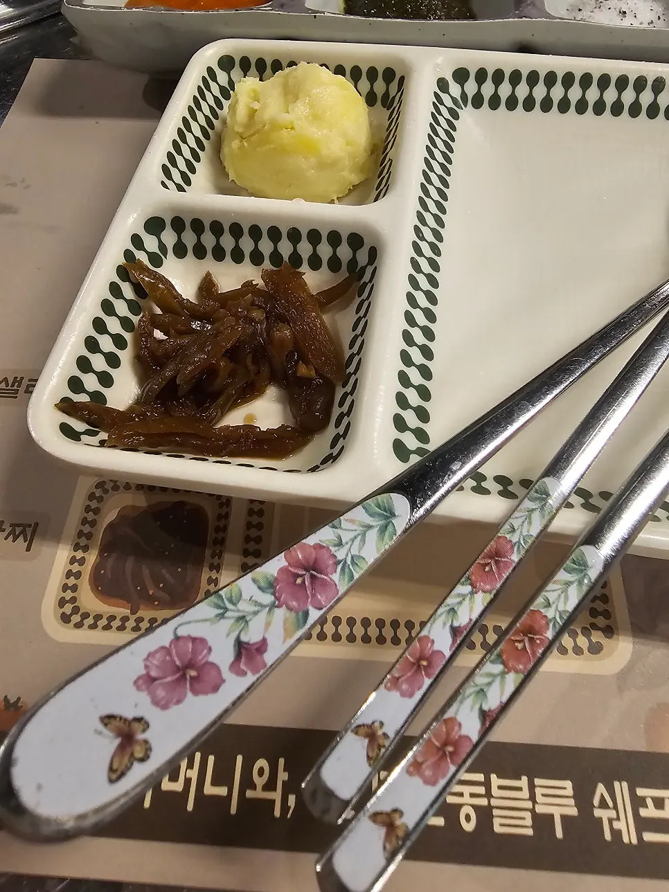 Table set with sauces and side dishes as shown on the setting paper