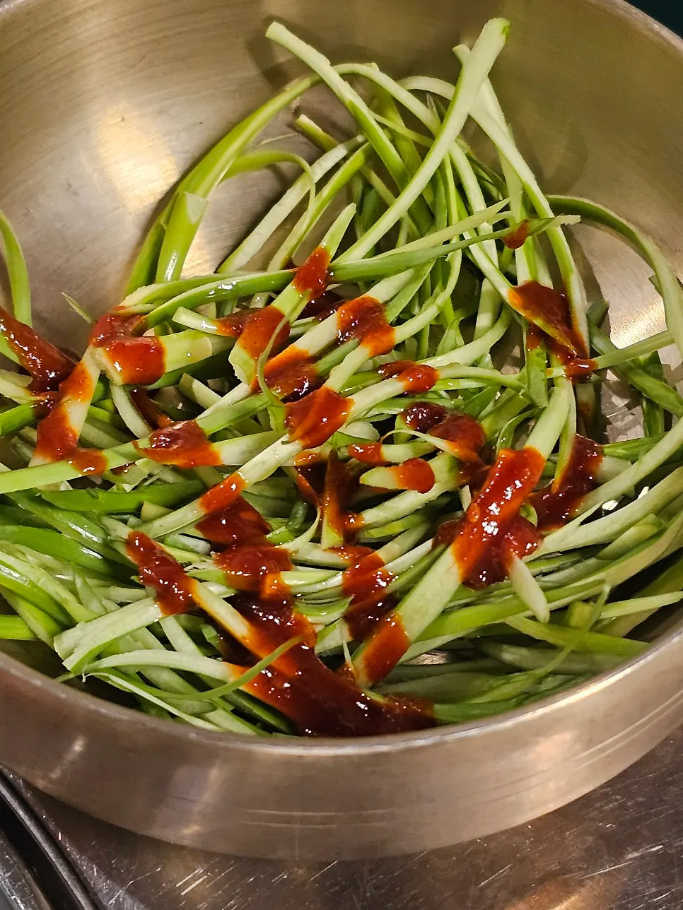 Meat placed at the center of the grill with rendered fat