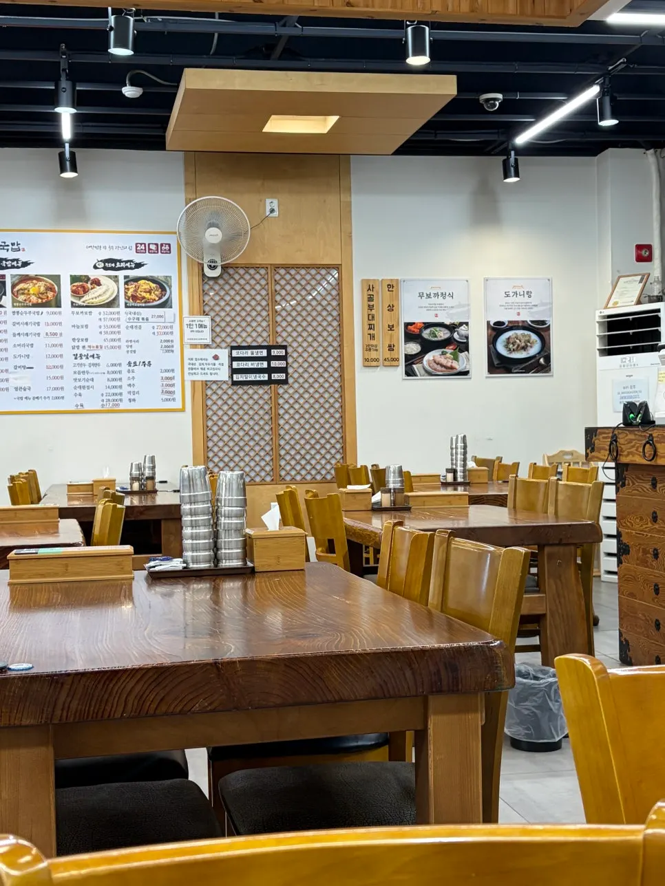 Restaurant interior with wood-toned tables