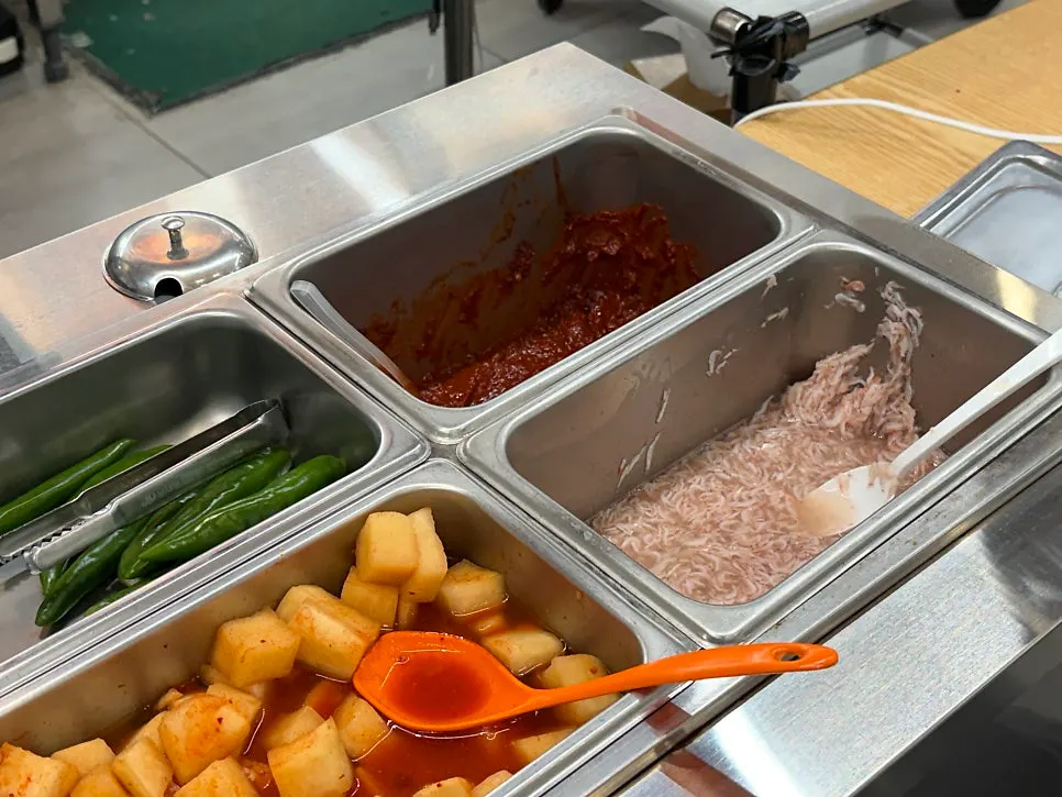 Basic sides of kimchi, kkakdugi, and seasoned chives