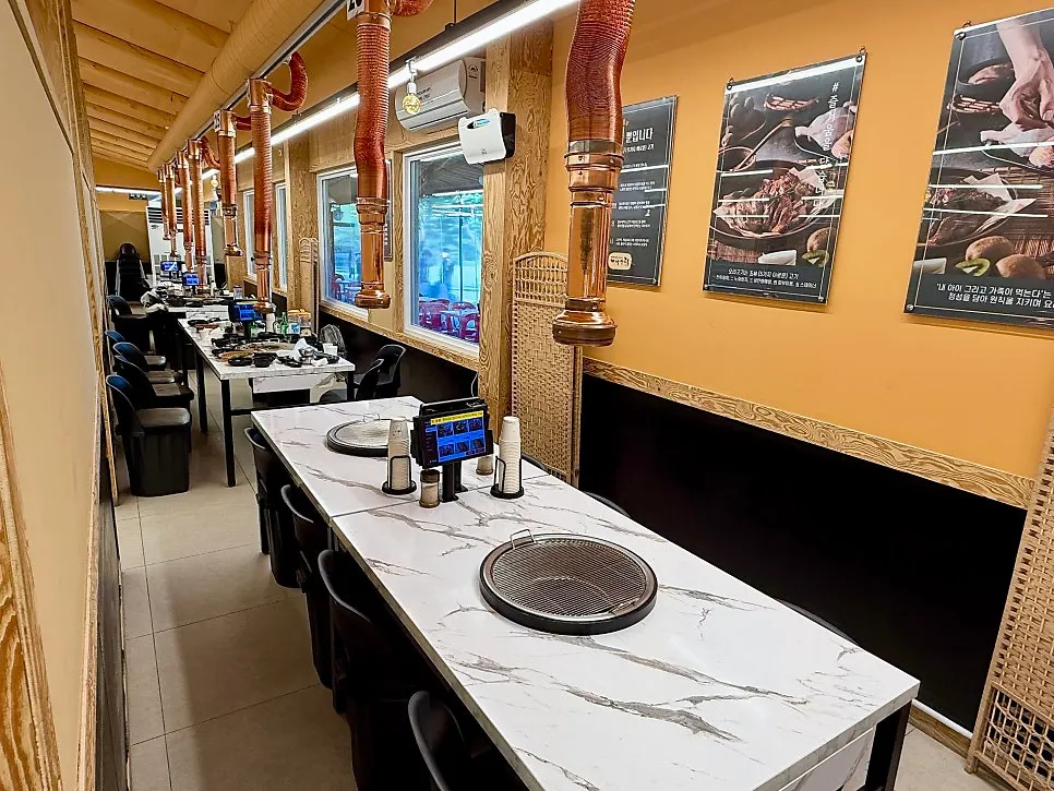 Interior with tables spaced widely apart