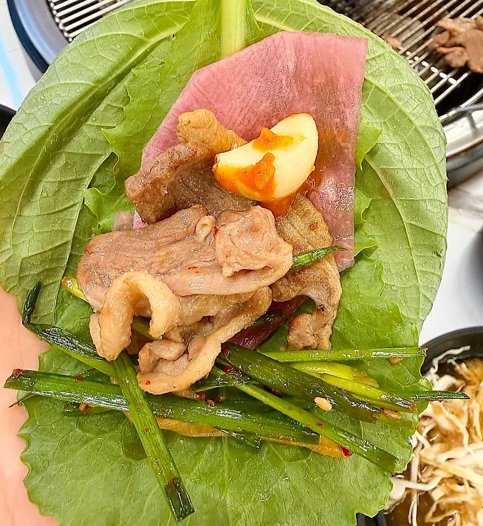 A piece of duck served with side dishes