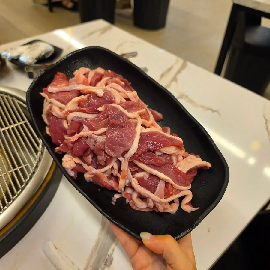 Raw duck charcoal grill, 700g, served on a plate