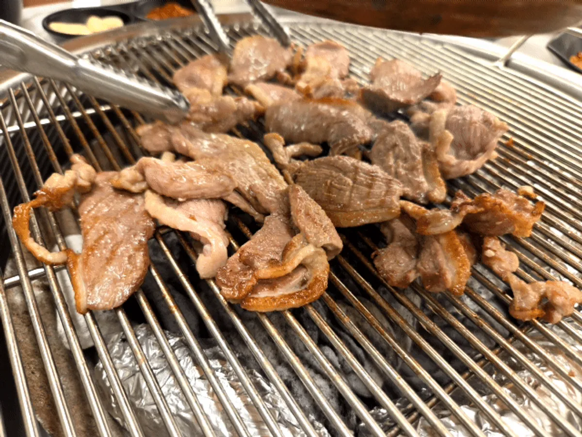 Signature charcoal-grilled duck photo at Ganaandeok Gyeyang Branch