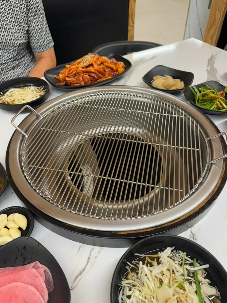 Self-serve bar with banchan and seaweed soup