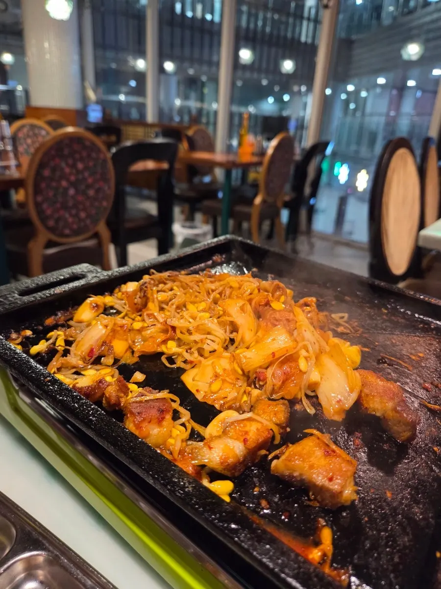 Refilled bean sprouts and kimchi on the grill