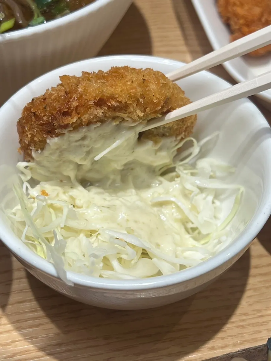 Seafood croquette served on cabbage salad
