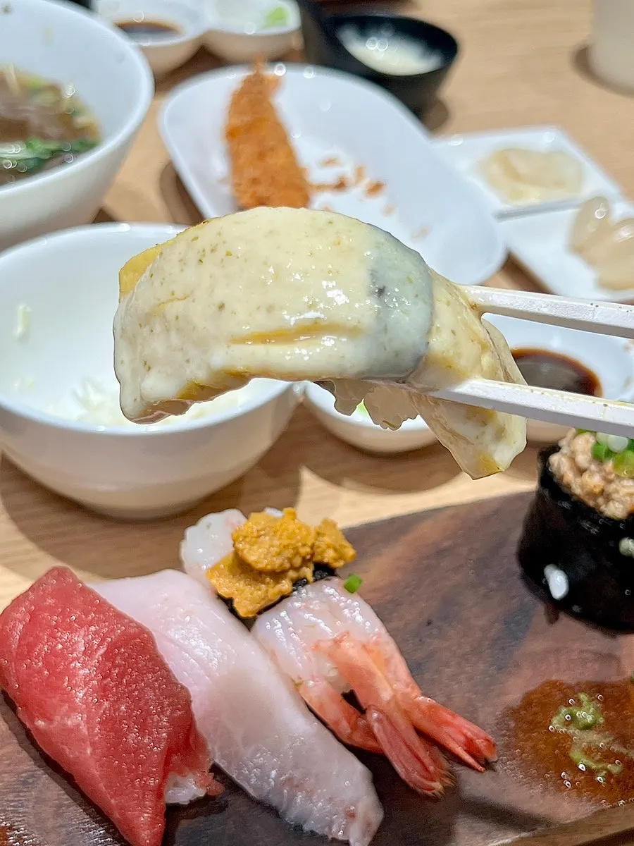 Sauce-topped flame sushi with scallop and shrimp