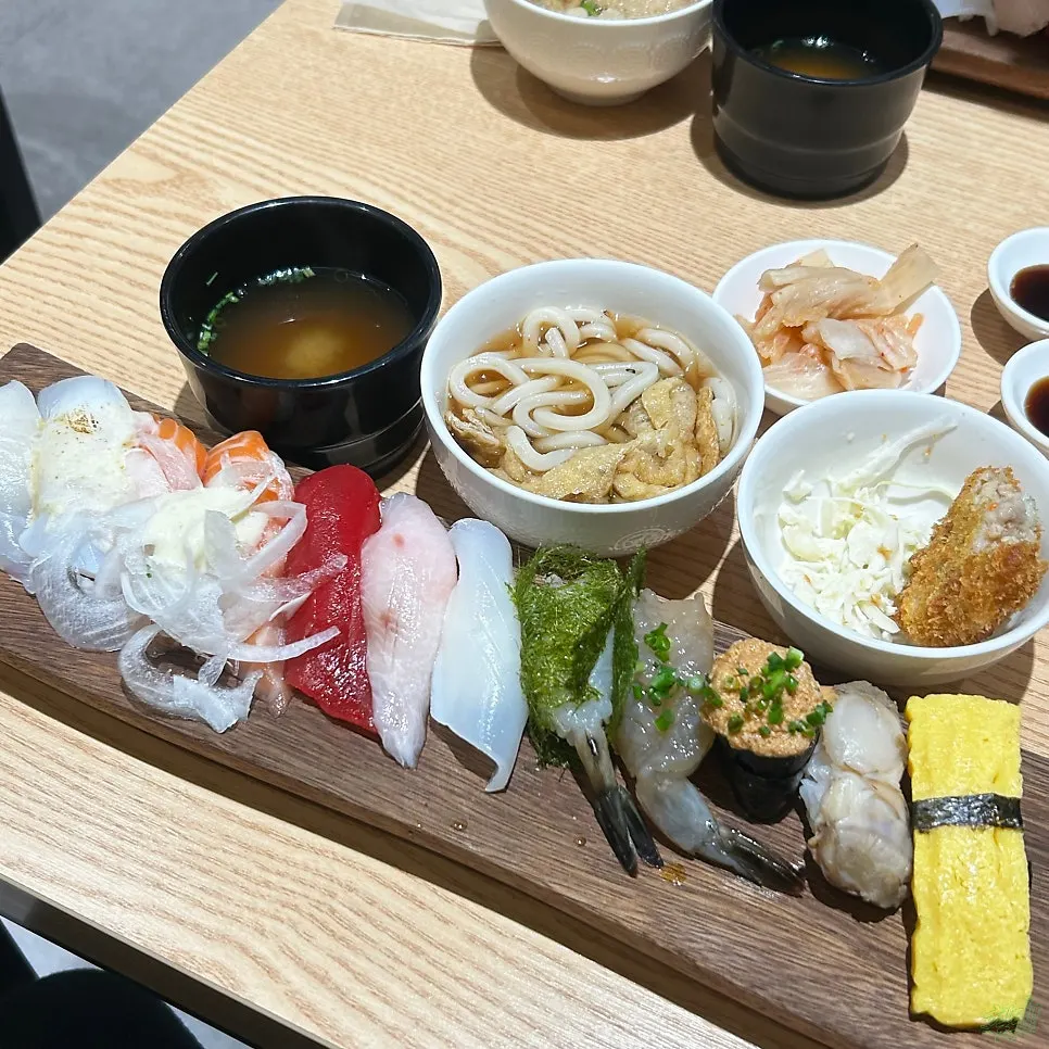 Table set with pickled radish, soy sauce, and ginger