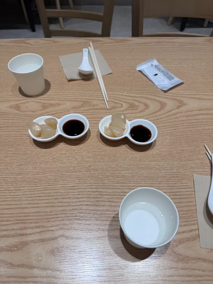 Plates and basic utensils stored on the side of the table