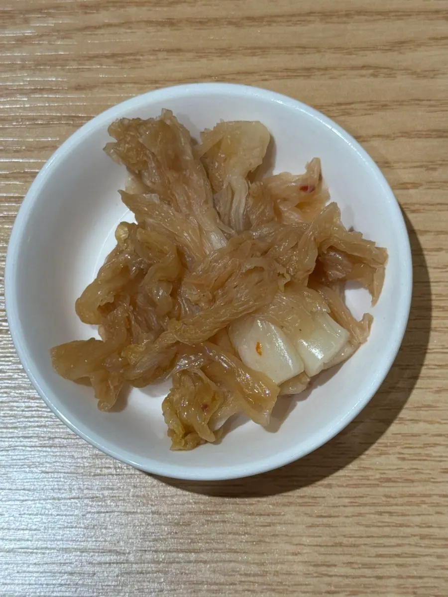 Plate of washed aged kimchi and other side dishes