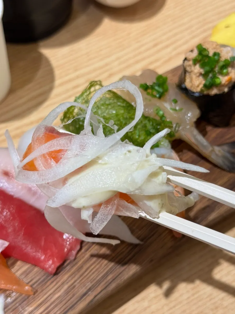 Raw salmon sushi with an orange hue