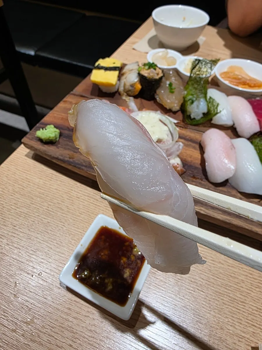 Two servings of Ganghan Sushi on a wooden plate