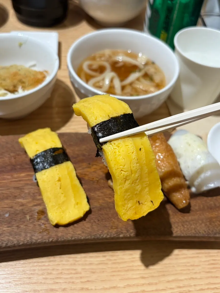 A piece of soy-marinated shrimp sushi