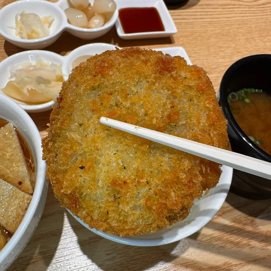 Close-up of crispy-outside, moist-inside seafood croquette