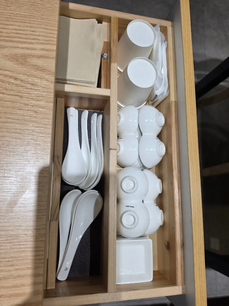 Neatly kept utensils in the drawer