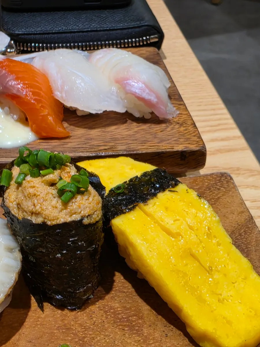 Close-up of sushi topped with salmon and tuna