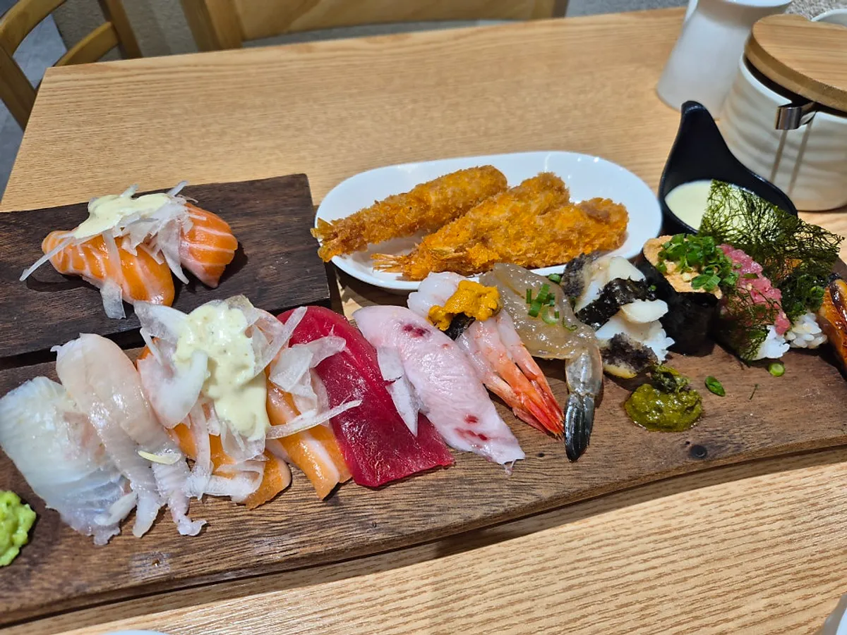 12 pieces of sushi served with mini udon, seafood croquette, and miso soup