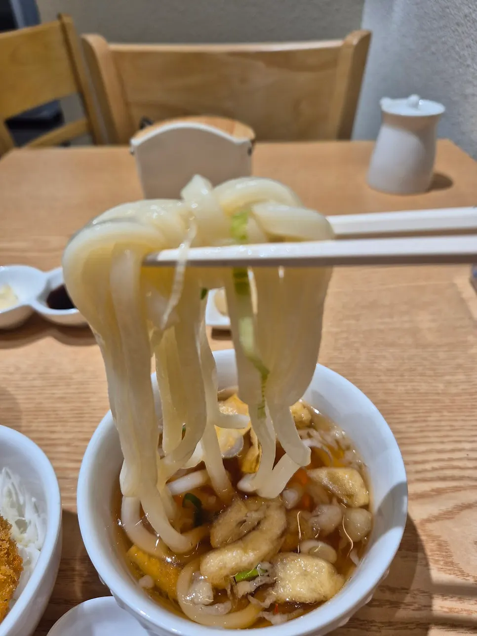 Bowl of mini udon with noodles and fried tofu