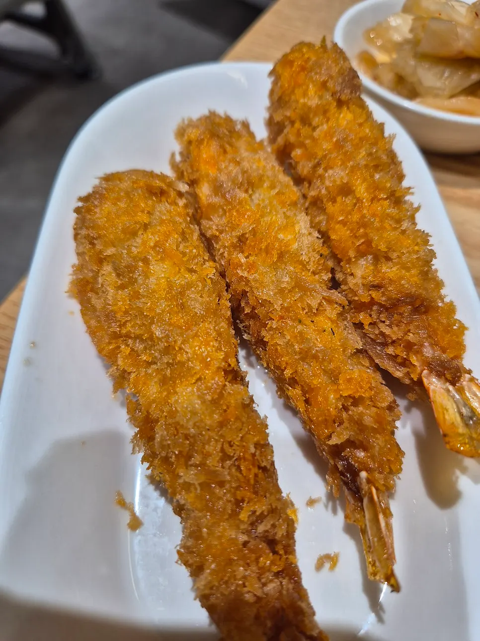 Three fried shrimp ordered as a side dish