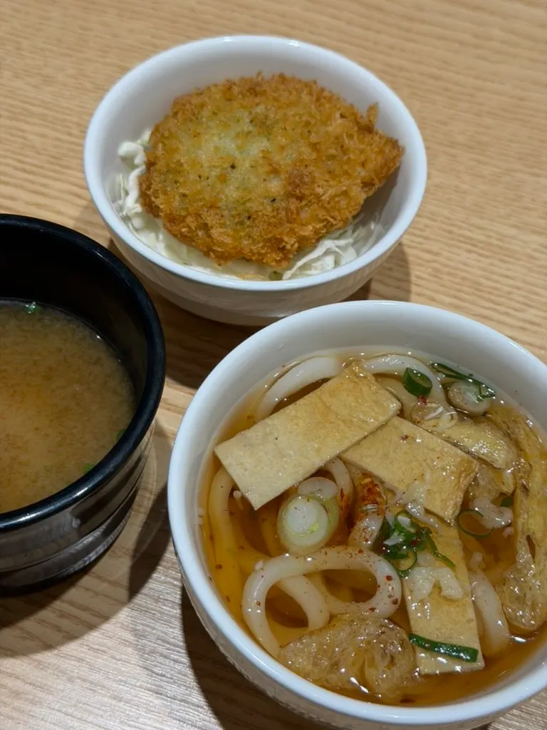 Mini udon, miso soup, seafood croquette and washed aged kimchi side dishes