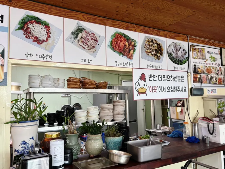 Restaurant view with charcoal par-grilling notice