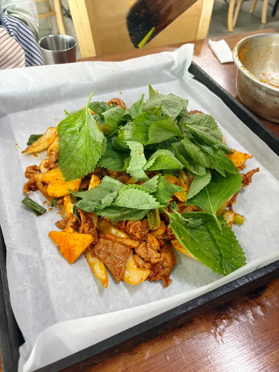 Par-grilled duck jumulleok placed on the table grill