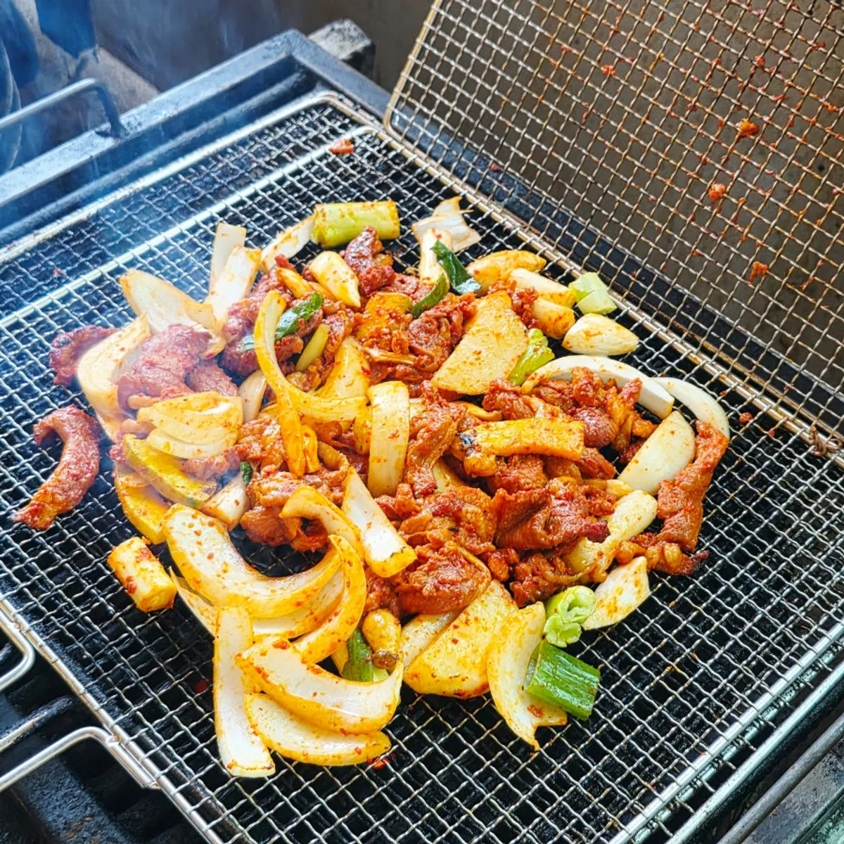 Table spread of duck jumulleok at Deok Ori Jumulleok Ganghwa Main Branch