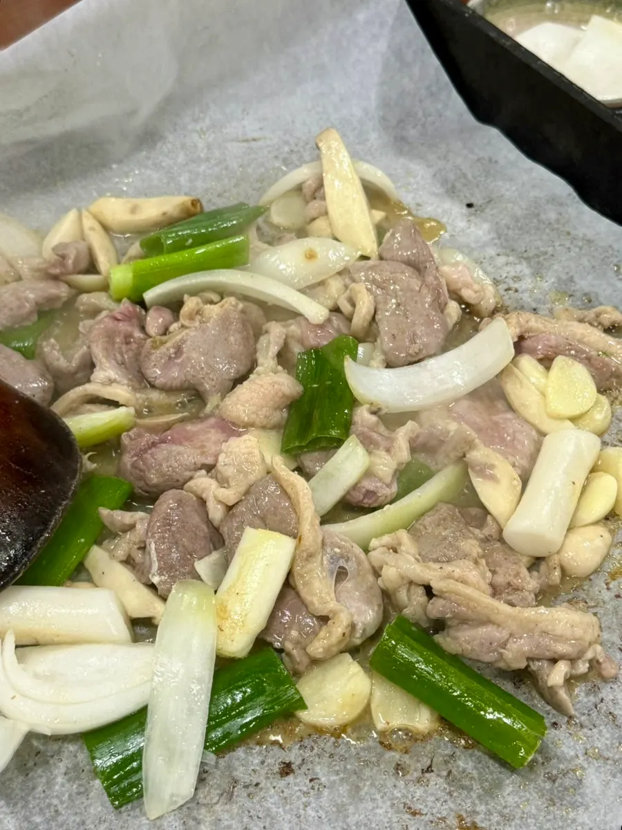 Duck pre-grilled over charcoal fire