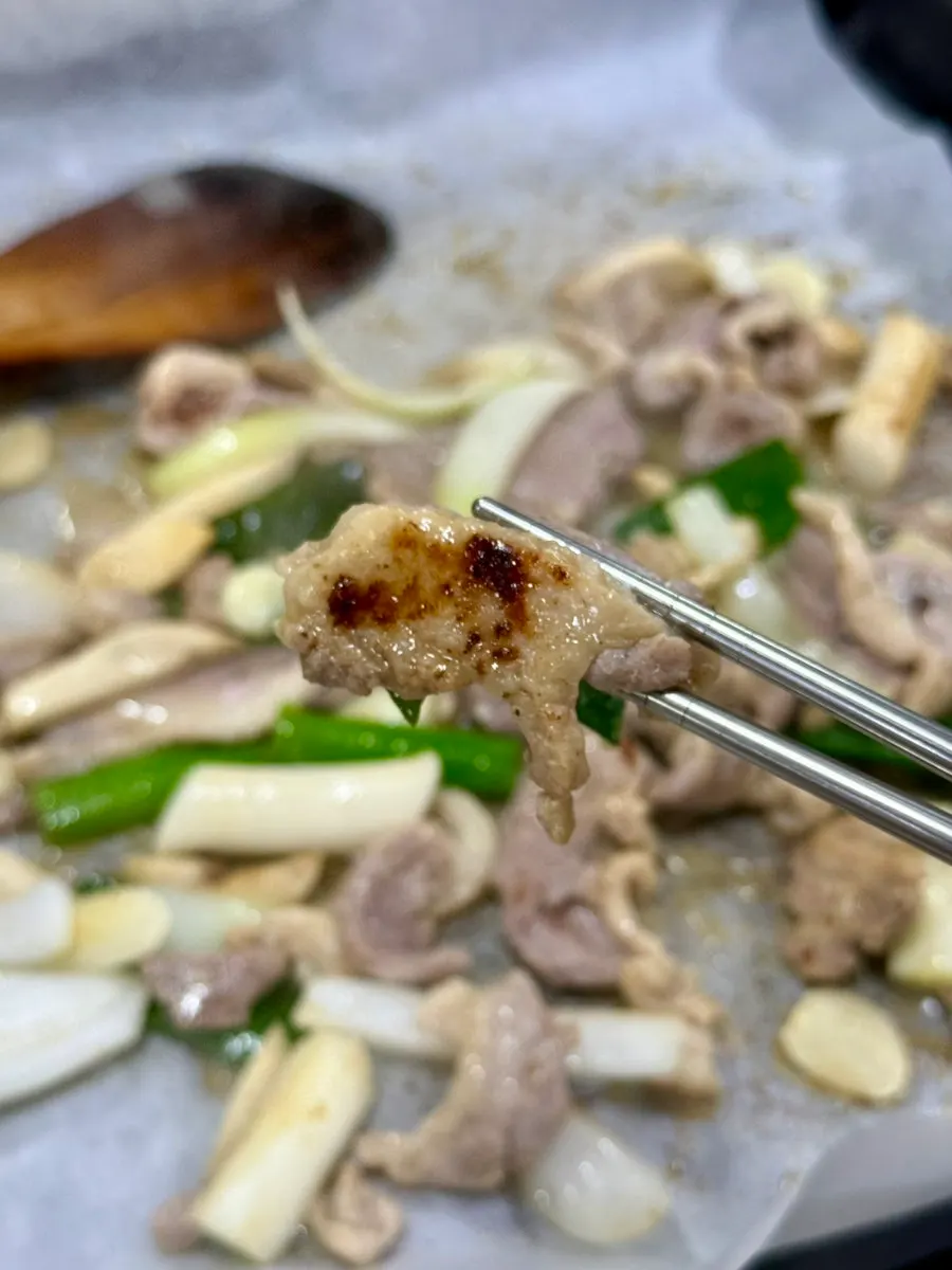 Duck roast on the grill with mushrooms and rice cakes