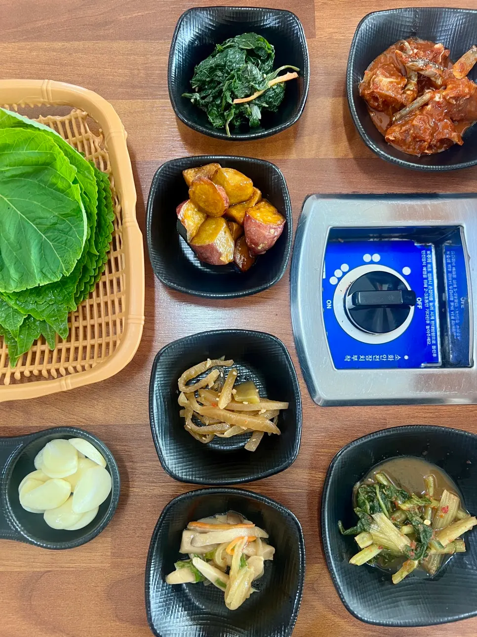 A spread of basic side dishes and lettuce wraps