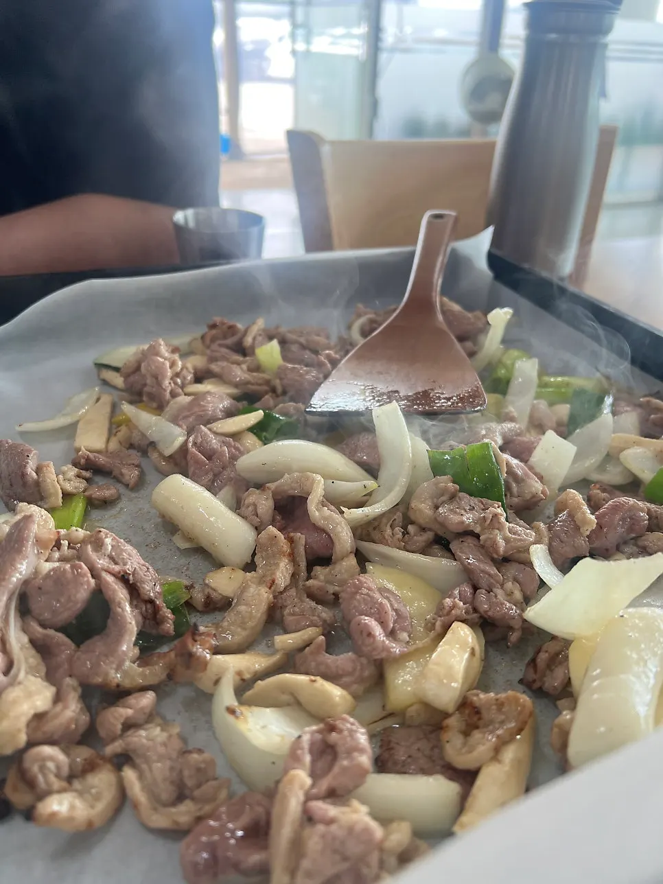 Flipping the duck meat under paper foil