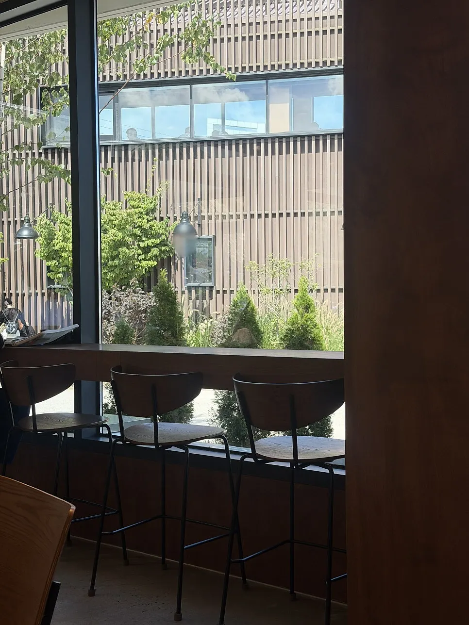 Café interior with wood-toned tables