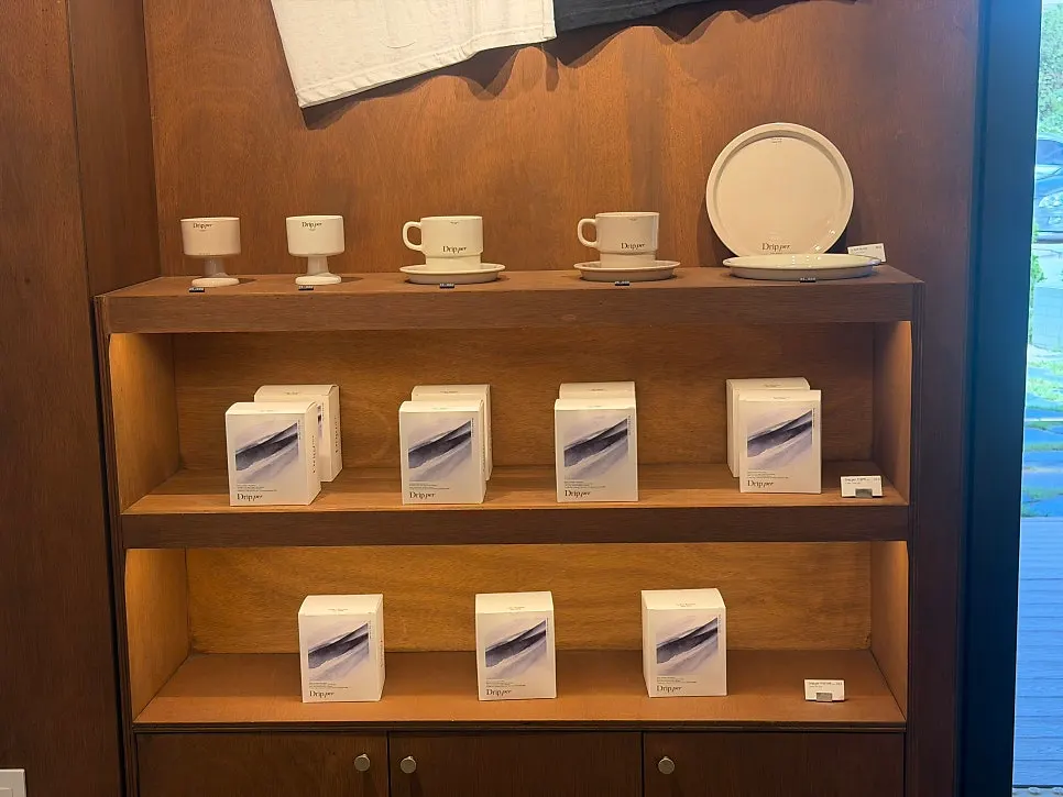 Display shelf with coffee beans and goods for sale