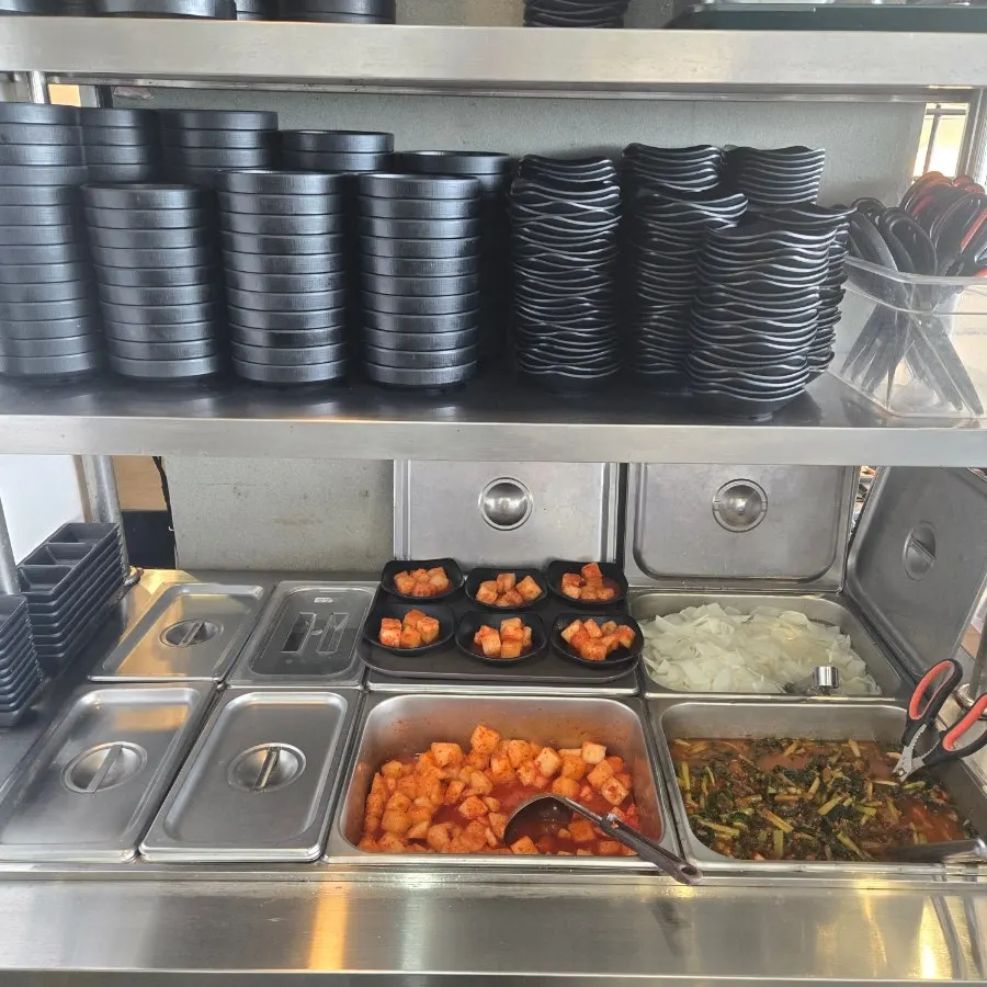 Self-serve side dish corner with yeolmu kimchi and kkakdugi